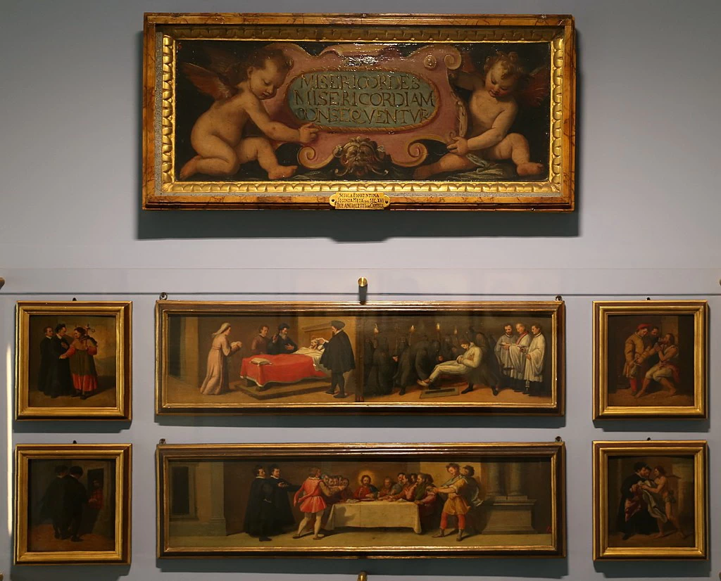 S. putti con cartiglio e opere di misericordia, dall'altare ligneo della misericordia